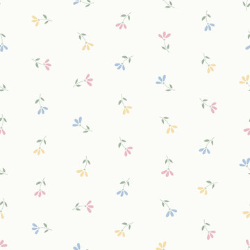 Seamless pattern of small pastel pink, blue and yellow flowers.