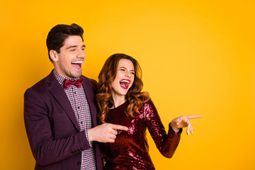 Portrait of his he her she nice-looking attractive lovely smart gorgeous chic classy cheerful cheery people having fun making jokes isolated over bright vivid shine yellow background