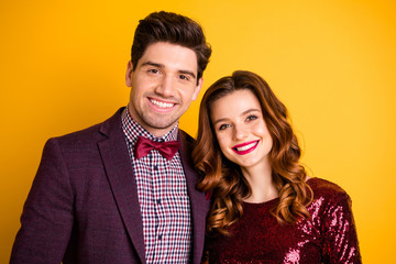 Close-up portrait of his he her she nice-looking attractive lovely charming cute cheerful cheery people embracing spending time occasion isolated over bright vivid shine yellow background