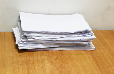 stack pile of paper on wood table background