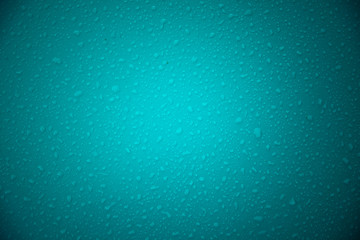 Water drops on blue green background