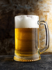 Lager beer mug close-up on rusty old background
