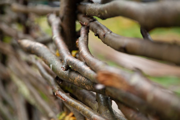 wooden wicker fence of branches made of twigs