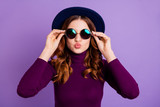 Close up photo of charming lady send air kisses touch specs isolated over purple background