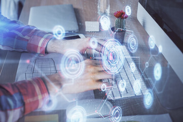 Businessman with computer background with technology theme hologram. Concept of big data. Double exposure.