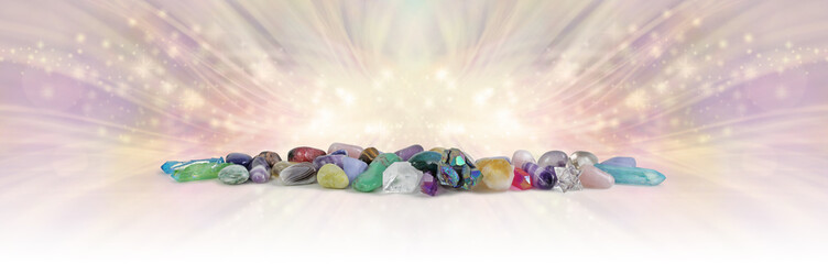The Magical Energy of Earth's Crystals - wide row of different coloured healing stones and...