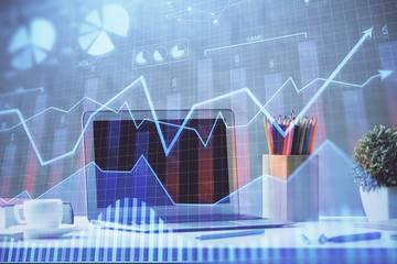 Financial market graph hologram and personal computer on background. Double exposure. Concept of forex.