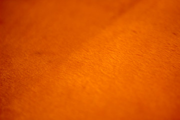 Orange reflective fabric background