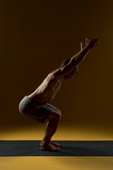 Man doing exercise on yoga mat
