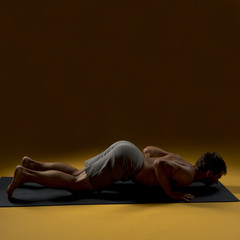 Man laying down on yoga mat