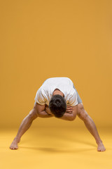 Man exercising in yoga pose
