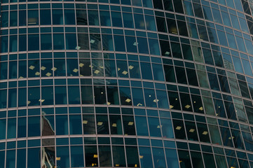 blue glass windows of modern office building