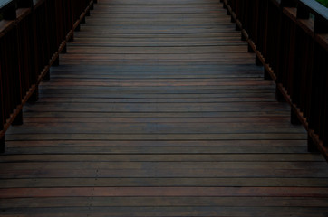 Fototapeta na wymiar Wooden floor terrace with blurred patterned background