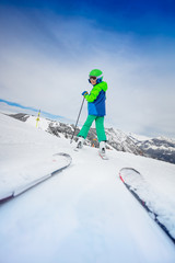Fototapeta na wymiar Ski school instructor view of boy on the slope