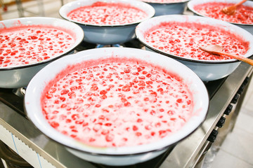 Strawberry jam cooking process. Organic traditional jam manufacturing.