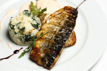 grilled eel or grilled mackerel with mashed potatoes with greens, cream sauce with caviar