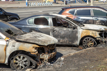 21.08.2019 Vinnitsa, Ukraine: Tree City Cars Burned.Burnt car with small flames inside of the engine or in the case of intentional arson