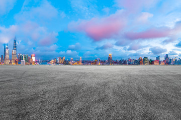 Shanghai skyline and modern buildings with empty race track at night,high angle view