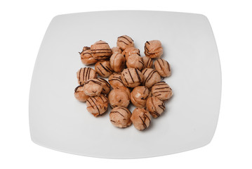 Shaped like nuts cookies on white isolated background