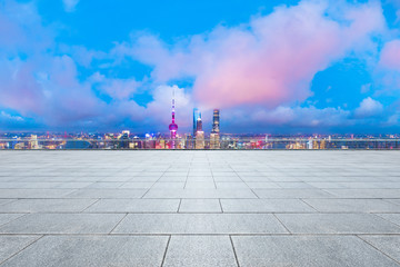 Shanghai skyline and modern buildings with empty square floor at sunrise,high angle view.