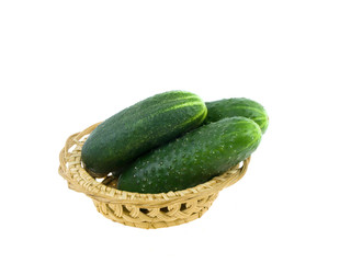 Cucumbers in a basket on a white background