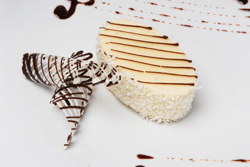 Piece of delicious cheesecake on a white isolated background