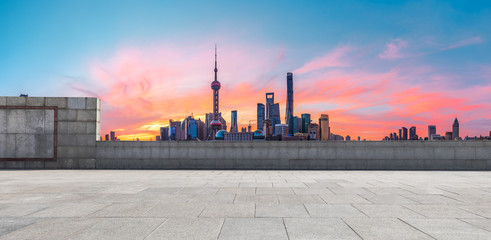 Shanghai skyline and modern buildings with empty square floor at sunrise,China.