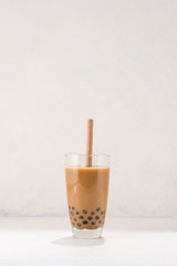 Chocolate Bubble Tea glasses with drink straw on white background.