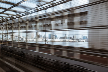 motion-blurred view from a moving train running in tunnel