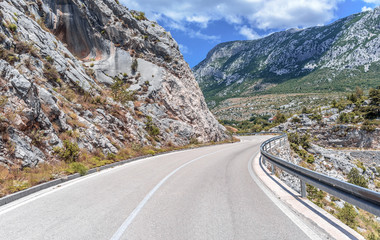 Fototapeta premium Mountain road on a summer sunny day.