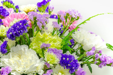 close up of colorful bouquet blooming  mixed  flowers with  droplet, on petal for background.