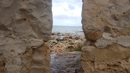 looking through to the gap to the sea and rocks