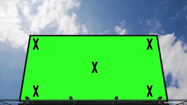 Billboard with green screen and tracking markers. Video mock up for advertisement, promotion. Big board with blue sky, clouds time lapse. 