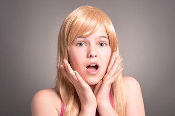 Portrait of blonde girl posing in studio