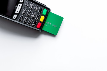 payment terminal with card on white background top view