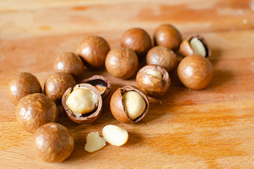 still life of macadamia nuts on a wooden stand
