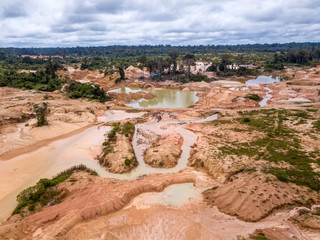 Aerial view of deforested area of the Amazon rainforest caused by illegal mining activities in...