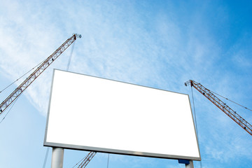 Blank Billboard with the crane on blue sky.out door advertising