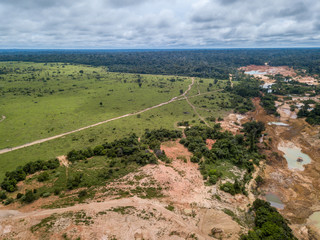 Aerial view of deforestation and destruction of the Amazon rainforest caused by illegal mining of gold and other metals on the BR 364 highway near Jamari National Forest in Rondonia state.