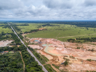 Aerial view of deforestation and destruction of the Amazon rainforest caused by illegal mining of gold and other metals on the BR 364 highway near Jamari National Forest in Rondonia state.