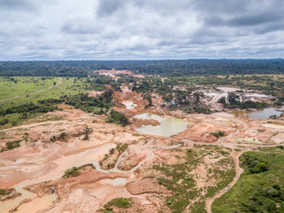 Aerial view of deforested area of the Amazon rainforest caused by illegal mining activities in...