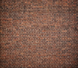 Full frame image of the old red brick wal. High resolution texture with vignetted corners for...