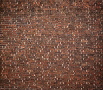 Fototapeta Full frame image of the old red brick wal. High resolution texture with vignetted corners for background, poster, collage in the urban loft or grunge style