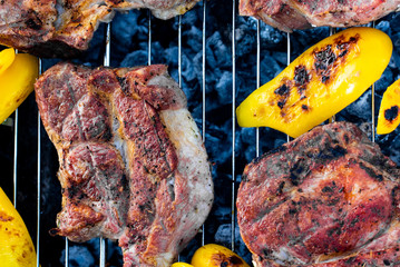 meat, steaks with grilled vegetables on the grill