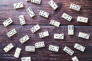 Domino game, dominoes on the wooden table background