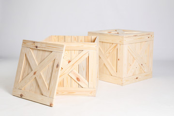 Pair of wooden crates on grey background