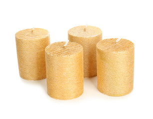 Stylish elegant gold candles on white background. Decor element