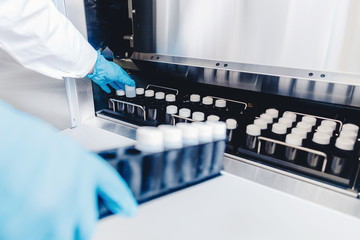 Medical professional places samples in sperm bank for storage and analysis. Concept cloning