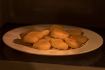Appetizing nuggets on a white plate
