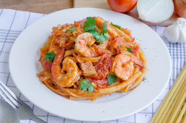 Macaroni, shrimp & bacon  with tomato sauce.